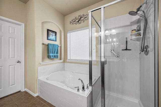 bathroom with tile patterned flooring and independent shower and bath