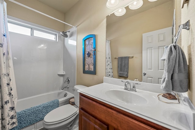 full bathroom with shower / bathtub combination with curtain, vanity, and toilet