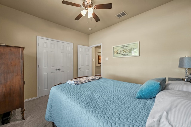 bedroom with ceiling fan, carpet floors, and a closet