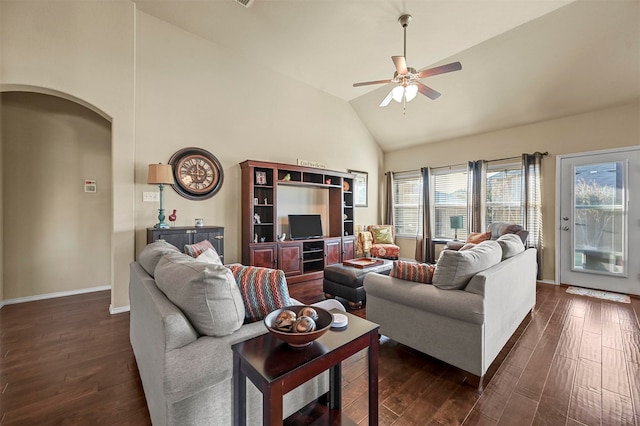 living room featuring high vaulted ceiling, ceiling fan, and dark wood-type flooring