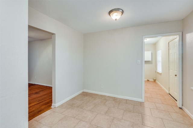 spare room with light wood-type flooring