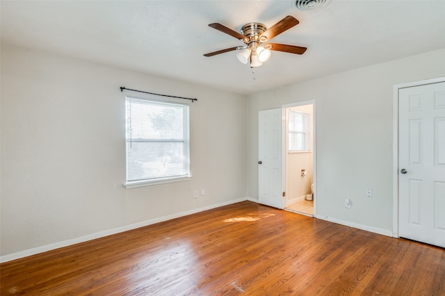 spare room with hardwood / wood-style flooring and ceiling fan