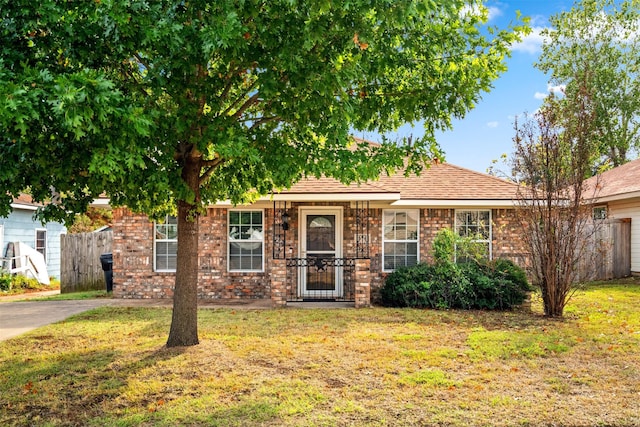 618 W Crawford St, Denison, TX 75020 - view of front facade featuring brick siding