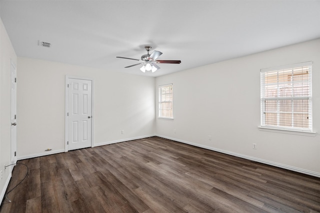 618 W Crawford St, Denison, TX 75020 - empty room featuring dark wood finished floors, ceiling fan, and baseboards