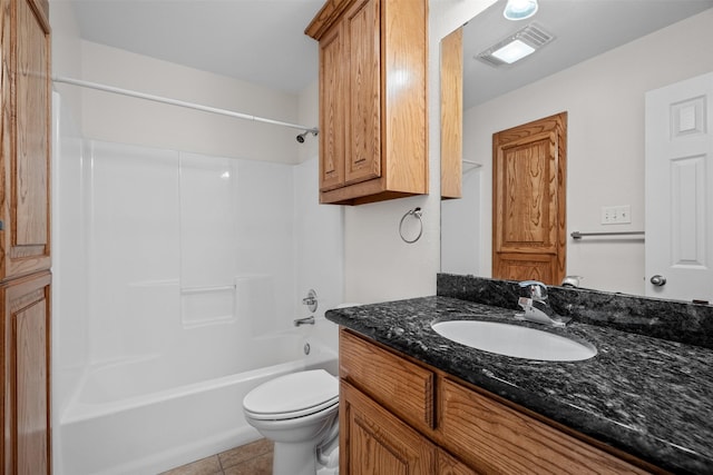 618 W Crawford St, Denison, TX 75020 - bathroom featuring toilet, vanity, tile patterned flooring, and shower / bath combination