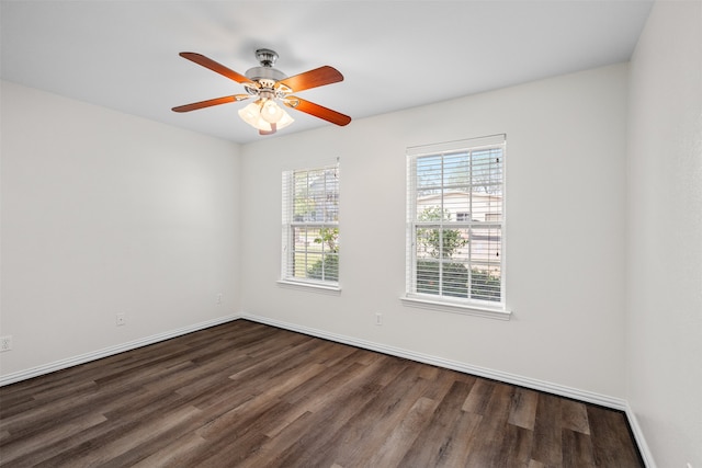 unfurnished room featuring ceiling fan and dark hardwood / wood-style floors