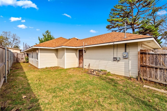 618 W Crawford St, Denison, TX 75020 - rear view of house with roof with shingles