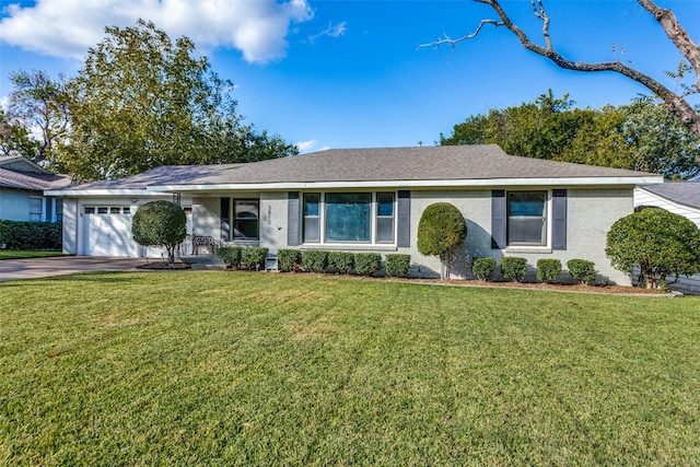 ranch-style home featuring an attached garage, brick siding, a front lawn, driveway, and a shingled roof