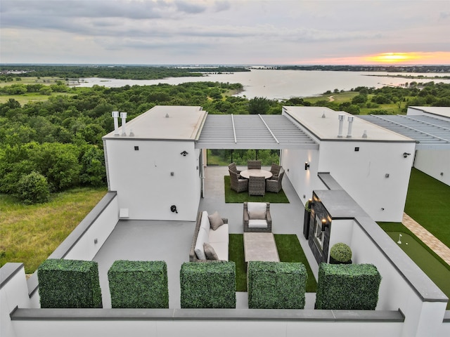 aerial view at dusk with a water view