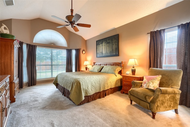 bedroom featuring ceiling fan, light colored carpet, and lofted ceiling