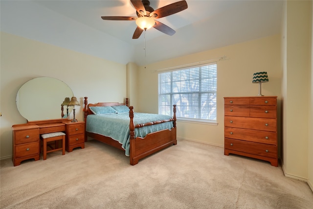 carpeted bedroom featuring ceiling fan and vaulted ceiling