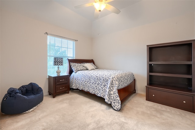 carpeted bedroom with ceiling fan and lofted ceiling