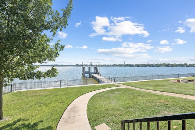 view of dock featuring a water view and a lawn