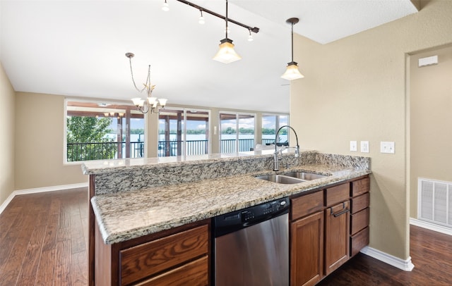 kitchen with a healthy amount of sunlight, sink, stainless steel dishwasher, light stone counters, and dark hardwood / wood-style flooring