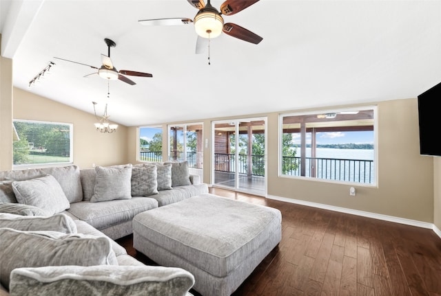 living room with vaulted ceiling, dark hardwood / wood-style floors, and ceiling fan with notable chandelier