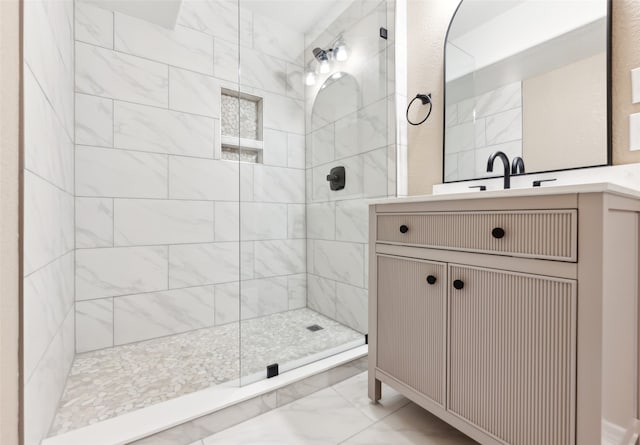 bathroom featuring vanity and a tile shower