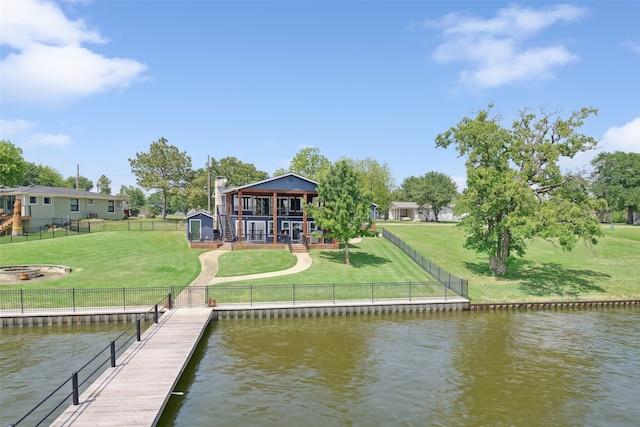 16077 Saint Paul Dr, Caney City, TX 75148 - dock area with a lawn, a deck with water view, and a fenced backyard
