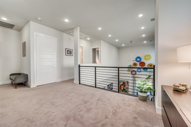 interior space featuring light carpet