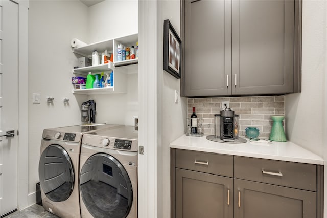 washroom with washing machine and clothes dryer