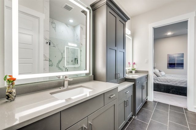 bathroom featuring vanity, tile patterned floors, and a shower with door