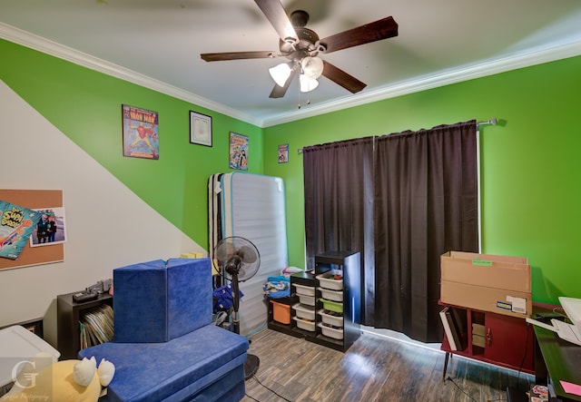 interior space with ornamental molding, hardwood / wood-style floors, and ceiling fan