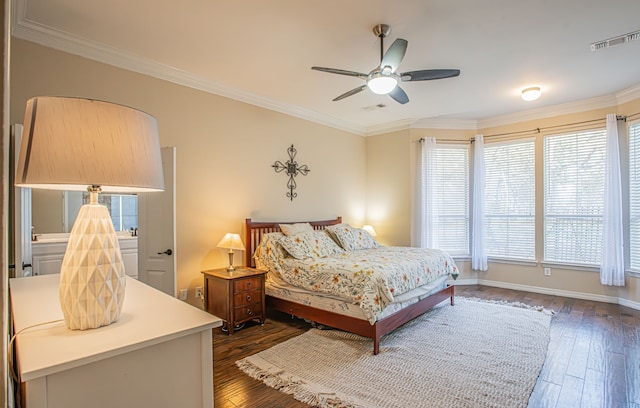 bedroom with crown molding, dark wood-type flooring, and ceiling fan