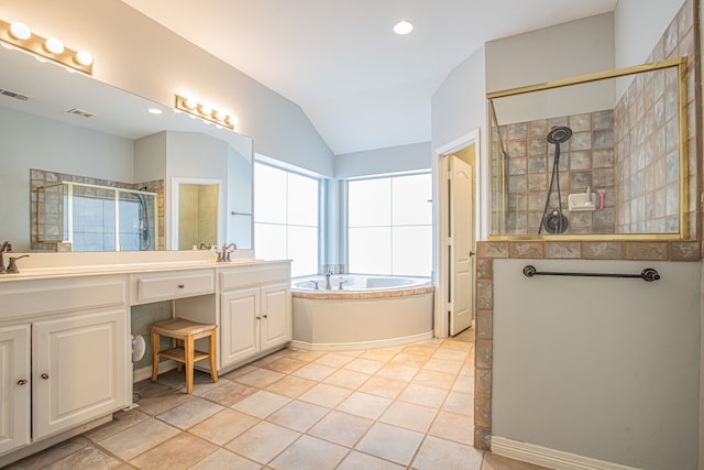 bathroom with vanity, vaulted ceiling, plus walk in shower, and tile patterned flooring