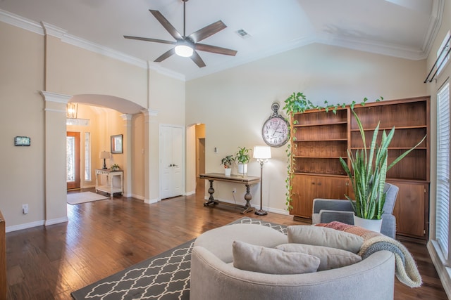 living room featuring ornate columns, crown molding, dark hardwood / wood-style flooring, and ceiling fan