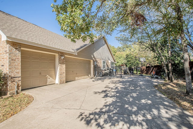 view of side of home featuring a garage