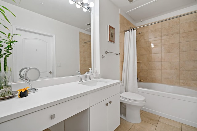 full bathroom featuring tile patterned flooring, shower / bath combination with curtain, vanity, and toilet