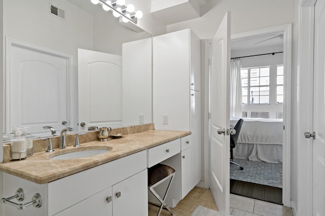 bathroom featuring tile patterned floors and vanity