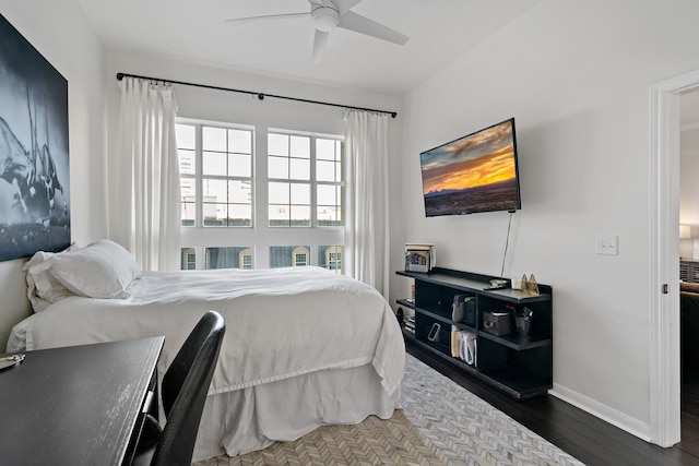 bedroom featuring wood-type flooring and ceiling fan