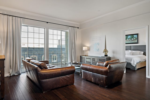 living room with dark hardwood / wood-style flooring and crown molding