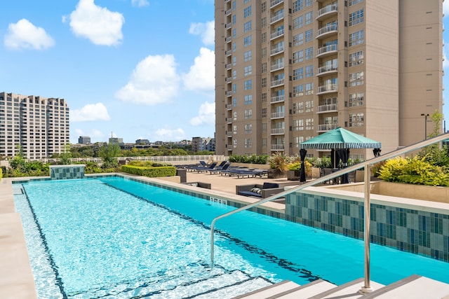 view of pool with a gazebo, pool water feature, and a patio area