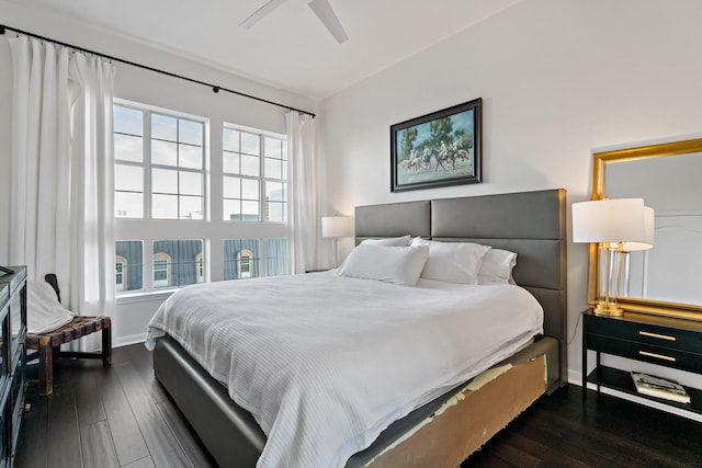 bedroom featuring ceiling fan and dark wood-type flooring