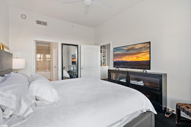 bedroom featuring ceiling fan, dark hardwood / wood-style floors, and ensuite bath