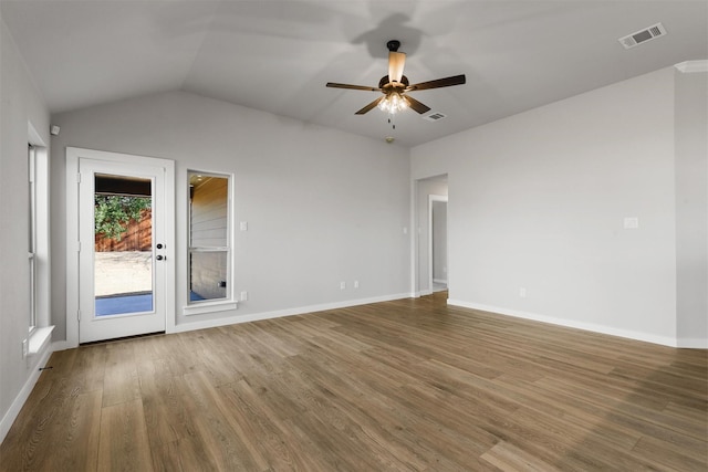 empty room featuring wood-type flooring, ceiling fan, and lofted ceiling