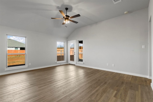 unfurnished room with hardwood / wood-style flooring, vaulted ceiling, and ceiling fan