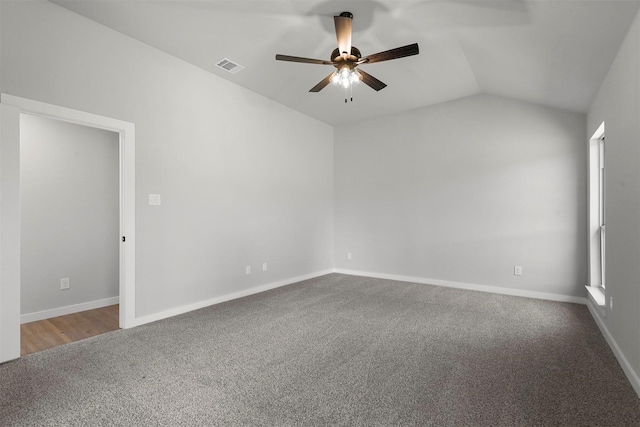 unfurnished room featuring carpet, ceiling fan, and lofted ceiling