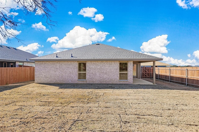 back of house with a patio