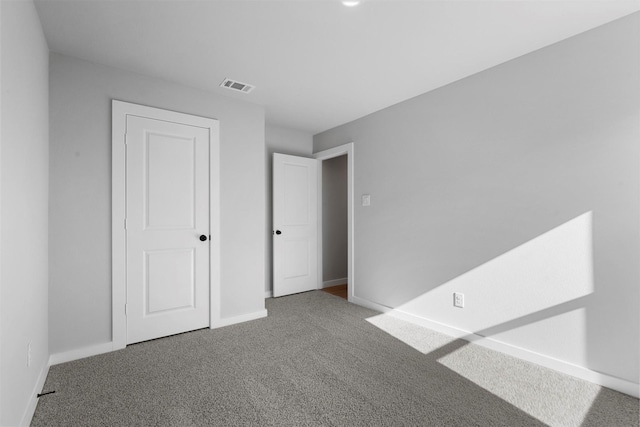 unfurnished bedroom with carpet floors