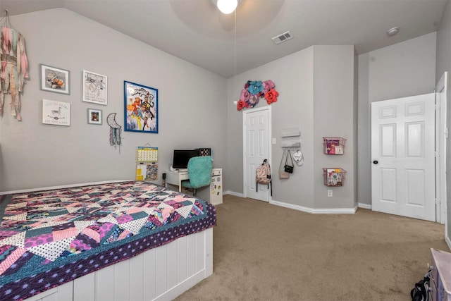 bedroom with a closet, ceiling fan, vaulted ceiling, and light colored carpet