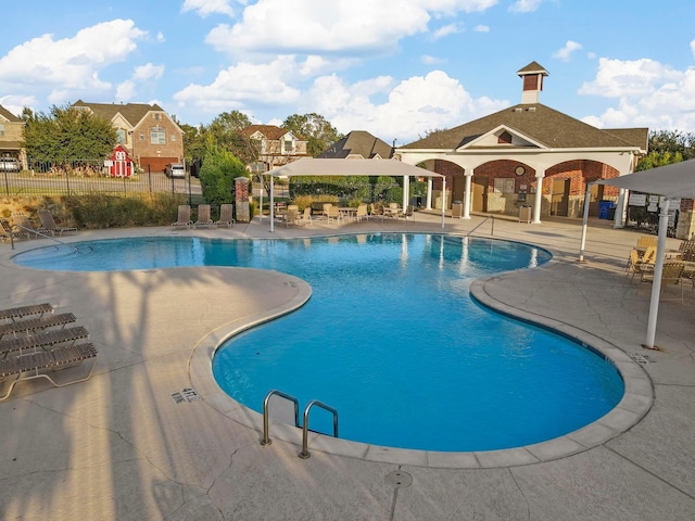 view of swimming pool with a patio