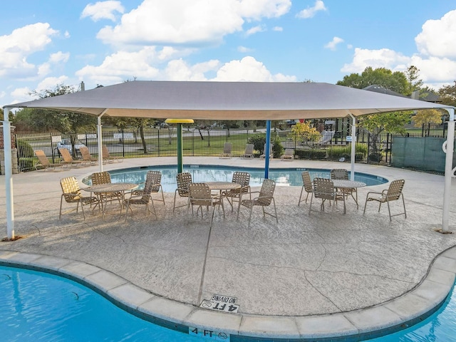 view of swimming pool featuring a patio