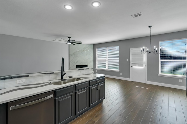 kitchen with dishwasher, a healthy amount of sunlight, sink, and hanging light fixtures