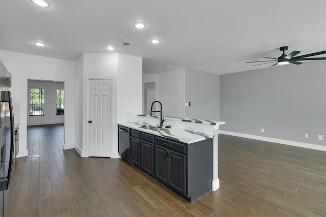 kitchen featuring ceiling fan, sink, stainless steel dishwasher, and dark hardwood / wood-style floors