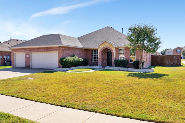 ranch-style home featuring a front lawn and a garage