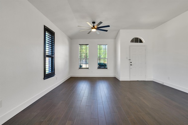 empty room featuring ceiling fan and dark hardwood / wood-style floors