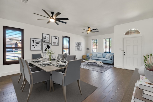 dining area with ceiling fan and dark hardwood / wood-style flooring