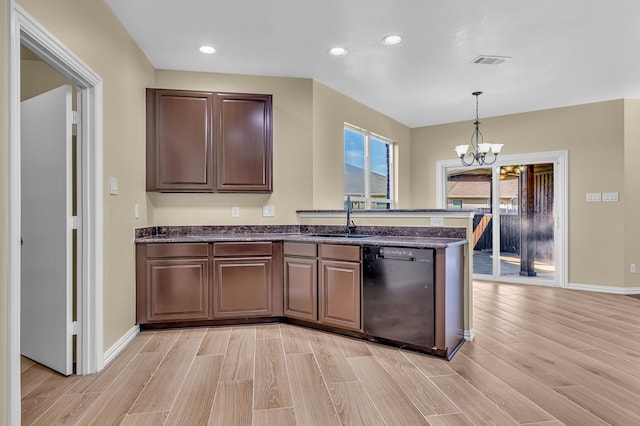 kitchen featuring dishwasher, light hardwood / wood-style flooring, sink, a notable chandelier, and pendant lighting